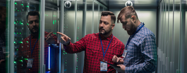two guys standing in server room